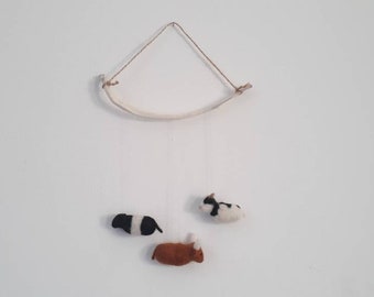 Cow Mobile. Felted cows hanging from a real calf rib