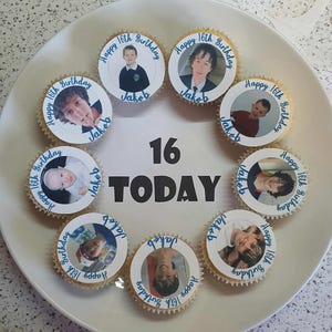 May include: A white plate with nine cupcakes decorated with photos of a young man at different ages. The cupcakes are arranged in a circle around the number "16" and the word "TODAY". Each cupcake has the text "Happy 16th Birthday" and "Jakob" written on it.