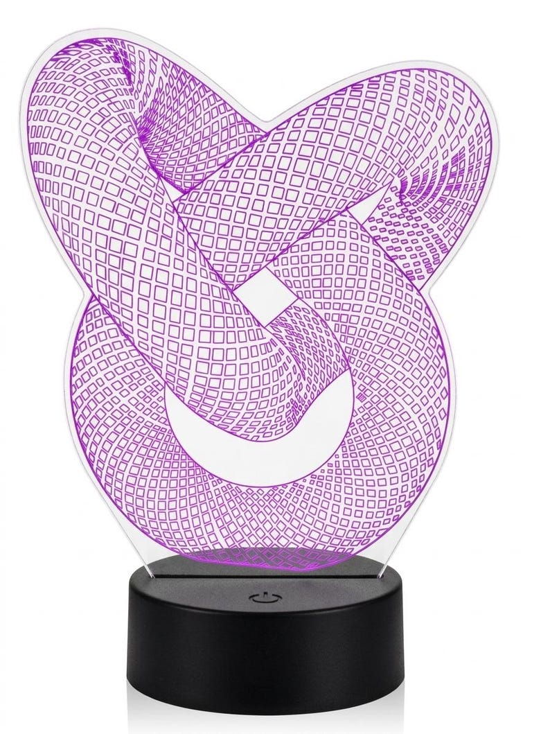 May include: A modern, geometric 3D illusion lamp. The design features a purple, intertwined shape with a grid pattern, mounted on a black base. The lamp is designed to create a visual effect when illuminated.