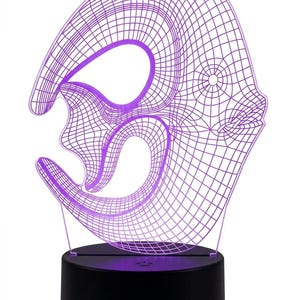 May include: A purple 3D wireframe sculpture night light. The light has a unique, abstract design with a black base. The light emits a soft purple glow, creating a modern and artistic ambiance.