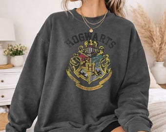 Harry Potter Distressed Hogwarts Crest Officially Licensed Adult Oversized Comfort Colors T-Shirt and Crewneck Sweatshirts