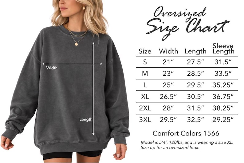 May include: A woman wearing a dark gray oversized sweatshirt. The image includes a size chart with measurements in inches for width, length, and sleeve length. The chart ranges from size S to 3XL.