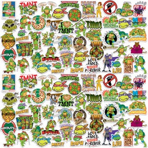 May include: A collection of colorful Teenage Mutant Ninja Turtles stickers featuring the four turtles, pizza, and various phrases. The stickers showcase the turtles in action poses, with vibrant green, red, blue, and purple hues.