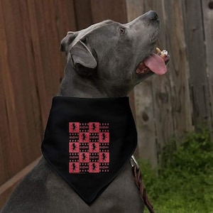 May include: A black dog bandana with a red and black checkerboard pattern. Each square features a silhouette of a lion and the word "Gryffindor". The dog is gray with its tongue hanging out.