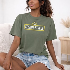 Sesame Street Rough Logo Officially Licensed Adult Oversized Comfort Colors T-Shirt and Crewneck Sweatshirts