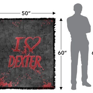May include: A black throw blanket with a distressed design and the text "I ❤️ Dexter" in red. The blanket measures 50 inches by 60 inches and has a fringed edge. The design includes red splatter details.