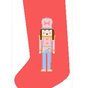 Puede incluir: Un cascanueces de juguete de soldado rosa y azul con un sombrero rosa y una pajarita en una media roja.