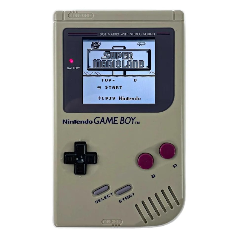 May include: A beige Nintendo Game Boy handheld gaming console with a black and white screen displaying the game Super Mario Land. The console has a red power button, a black directional pad, and two red buttons labeled A and B.