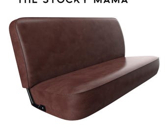 May include: A brown leather bench seat with a black metal frame. The seat is designed for a vehicle and has a curved back.