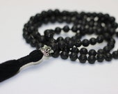 Ekpuja Black Lava Necklace 108 Lava Stone Beads and Lord Ganesh Pendant with Tassel Long Black Silver