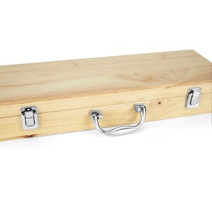 May include: A rectangular wooden box with a light brown finish. It has a silver handle and two silver latches. The box is designed for storage and transport.