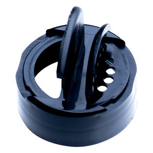 May include: A black plastic shaker lid with a round base and a raised, curved handle. The lid features a series of small holes and a hinged, slotted opening for dispensing contents. The design is simple and functional, suitable for various kitchen applications.