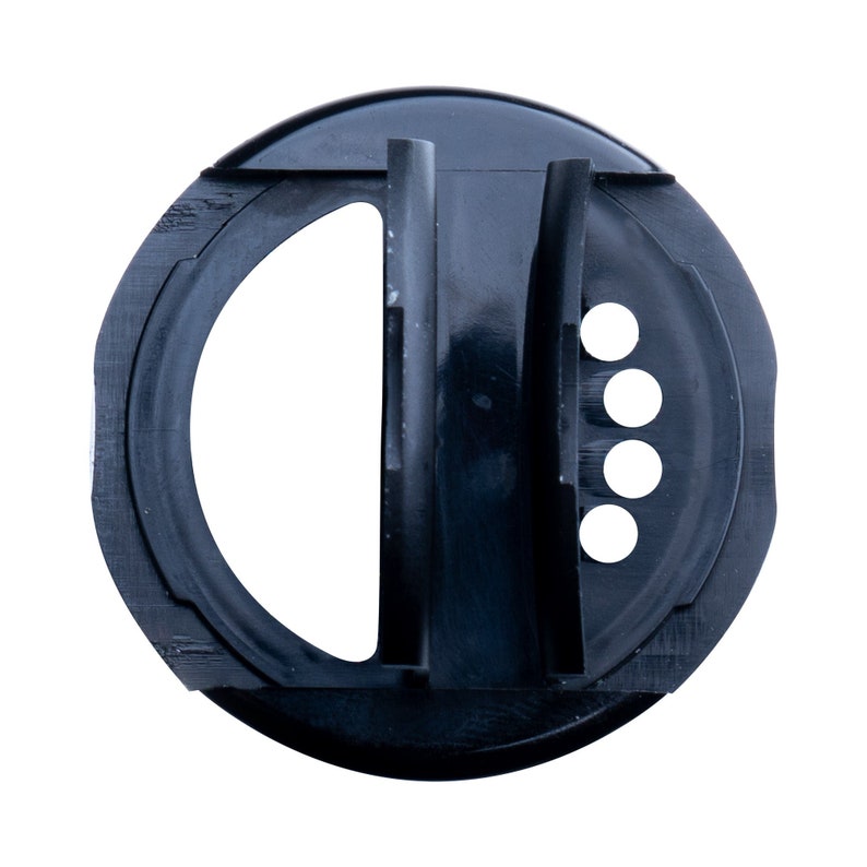 May include: A black plastic spice shaker lid with a large opening, a vertical divider, and four small holes. The lid is circular with a textured edge and is designed for dispensing spices.