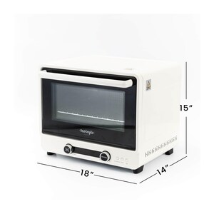 May include: A white countertop oven with a black glass door and handle. The oven is 18 inches wide, 15 inches high, and 14 inches deep. It has two control knobs and a digital display. The brand name "makeflo" is printed on the front.