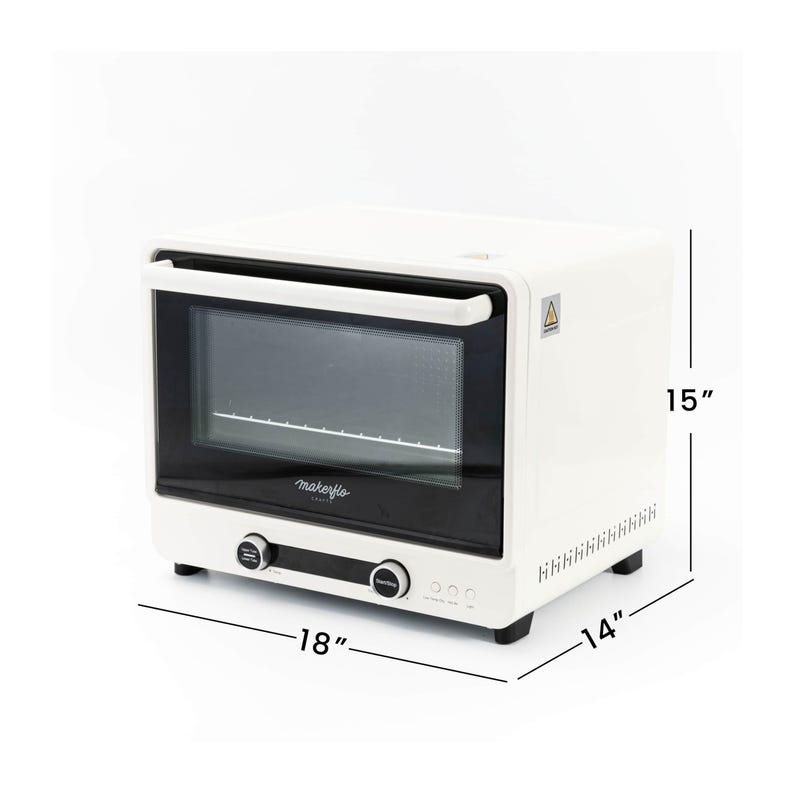 May include: A white countertop oven with a black glass door and handle. The oven is 18 inches wide, 15 inches high, and 14 inches deep. It has two control knobs and a digital display. The brand name "makeflo" is printed on the front.