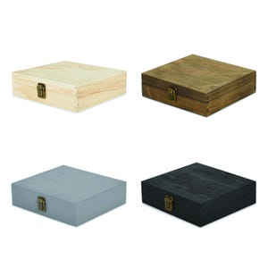 May include: Four square wooden boxes with hinged lids and brass-colored metal latches. The boxes are finished in four distinct colors: natural light wood, medium brown wood stain, light gray paint, and a dark black wood finish.