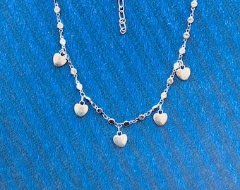 delicate silver necklace with heart pendants, love, romantic