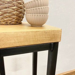Close up of rustic wood grain on handmade narrow side table