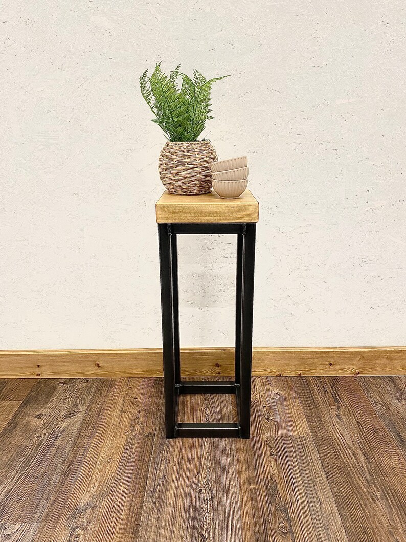 Space-saving industrial furniture piece with rustic wooden top