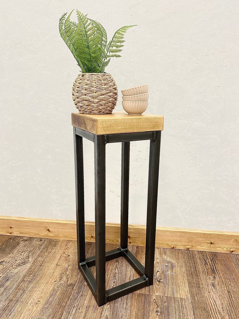 Narrow side table with rustic wood top and industrial metal frame