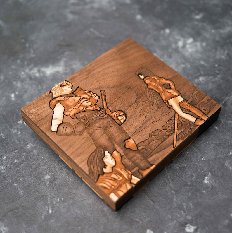 May include: A wooden plaque featuring a laser-engraved image of three characters from a video game. The characters are depicted in a forest setting. The plaque is crafted from dark wood and has a natural finish.