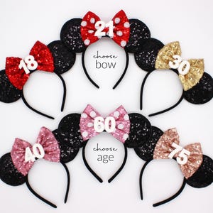 May include: Six black sequined headbands with mouse ears and decorative bows in red, gold, pink, and rose gold. The bows feature white polka dots and white numbers 18, 21, 30, 40, 60, and 75. Text on the image reads choose bow and choose age.