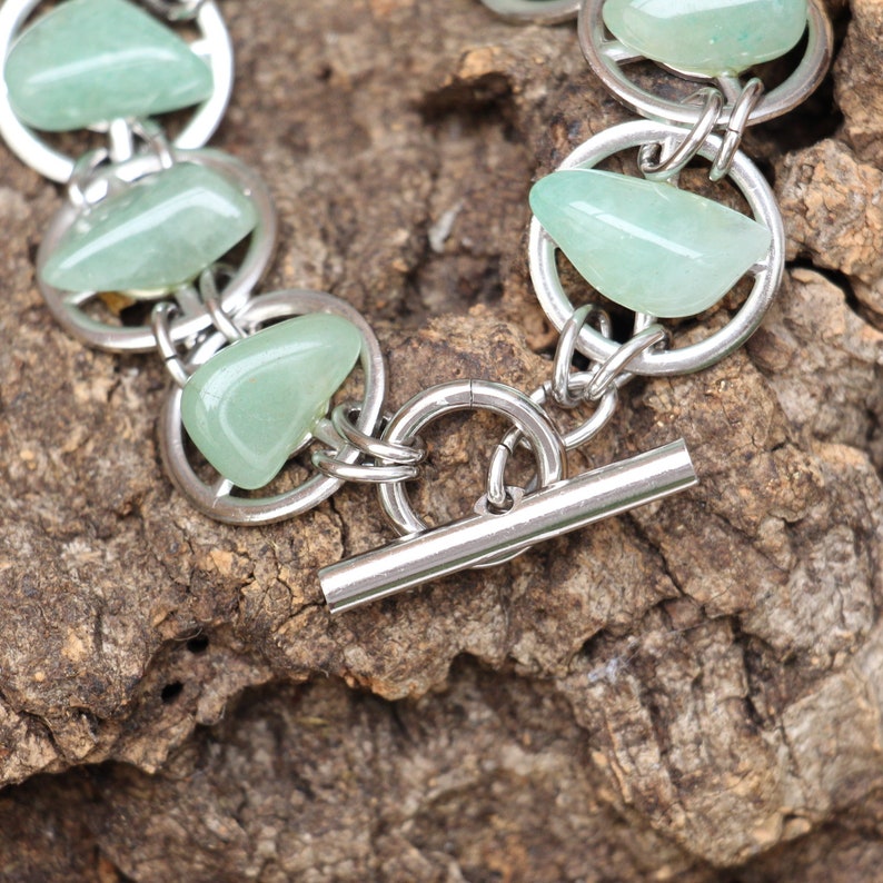 Gear bracelet with Green Gemstones