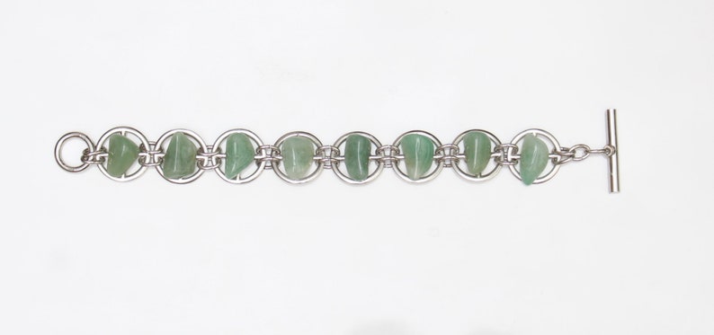 Gear bracelet with Green Gemstones