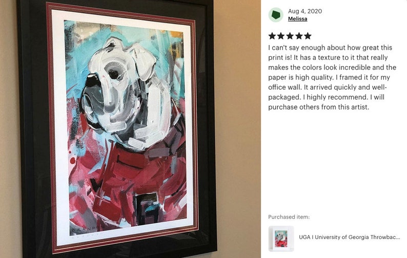 May include: A framed print of a white bulldog with red, blue, and black abstract paint splatters. The print is titled "UGA I University of Georgia Throwback..."