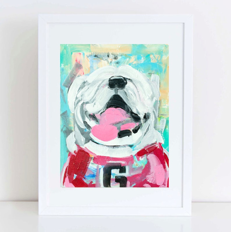 May include: A white bulldog with a pink tongue sticking out, wearing a red and pink sweater with a white 'G' on the front. The painting is done in a colorful abstract style.