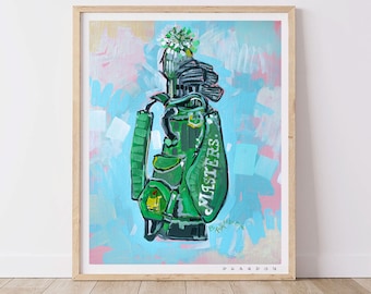 May include: A green golf bag with the word "Masters" printed on the side. The bag is decorated with a white flower and a blue and pink abstract background. The artist's signature is visible in the bottom right corner.