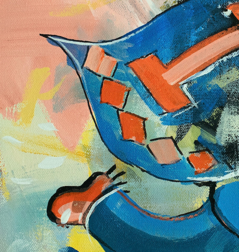 May include: A close-up of a blue and red abstract painting. The painting features a geometric pattern with a large red shape in the center.