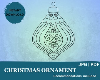 May include: A black and white line drawing of a Christmas ornament with intricate details. The ornament is shaped like a teardrop with a pointed top and a rounded bottom. It has a swirl pattern on the front and a scalloped edge.