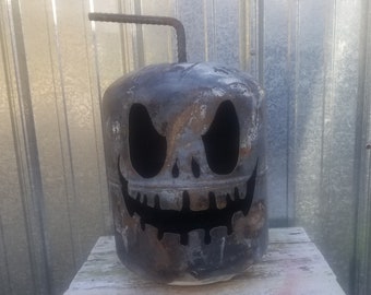 Muddled the Halloween pumpkins, Jack o lanterns, metal lawn art, front porch décor, garden decoration, yard art, gas can.