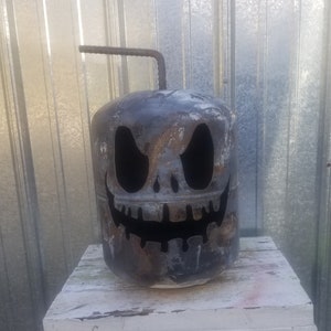 Muddled the Halloween pumpkins, Jack o lanterns, metal lawn art, front porch décor, garden decoration, yard art, gas can. image 1