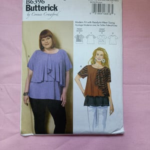 May include: A sewing pattern for a women's top with a layered design. The pattern is from Butterick and designed by Connie Crawford. The pattern includes instructions for two different styles of tops, one with a striped pattern and one with a solid color. The pattern is for sizes XXl-1X-2X-3X-4X-5X-6X.