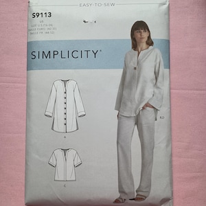 May include: Simplicity sewing pattern S9113 for a long-sleeve or short-sleeve tunic and trousers. The envelope features the text EASY-TO-SEW, S9113, and size information for U.S. sizes 16-24, Euro 42-50, and French 44-52. Includes line art illustrations.