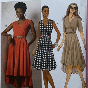 Plus Size Misses Dress Pattern. Butterick B6204. Mock wrap bodice, pockets. Sizes 14, 16, 18, 20, 22. Fitted, lined, skirt with shaped hem.