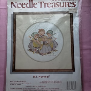 May include: Needle Treasures counted cross stitch kit featuring a M.I. Hummel® design called "Ring Around the Rosie". The kit includes 100% cotton floss, a needle, and instructions. The finished size is 10 inches in diameter or 25 cm. The frame size is 14 inches by 14 inches or 36 cm by 36 cm.