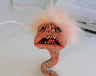 Escultura de arcilla de papel extraña: un juguete artístico adorable y espeluznante