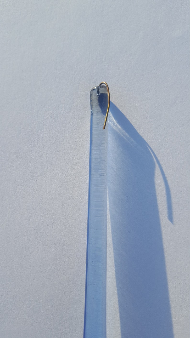 May include: A set of three ceramic mugs with a speckled, matte finish in cream, light grey, and dark grey. Each mug has a simple, modern design and a rounded handle.