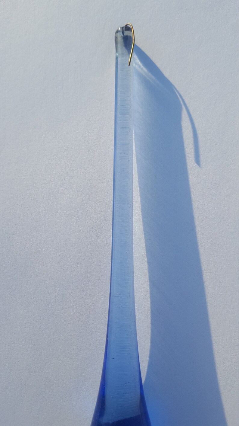 May include: A handmade wooden sign with the word "Welcome" in a whimsical font. The sign is painted white with a distressed finish, and features a small, decorative heart. It measures approximately 30 cm wide and 15 cm tall.