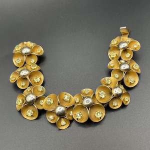 Vintage ornate floral bracelet, heavy moulded gold tone petals gold tone metal cabochon centres & yellow rhinestones, possible Haskell