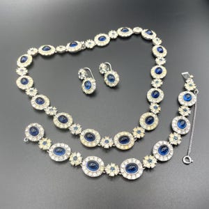 Vintage signed Ciner sapphire blue cabochon and clear rhinestone choker necklace, bracelet and dangle earrings for pierced ears