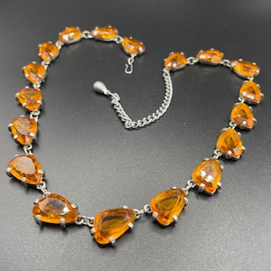 Vintage signed Sphinx citrine yellow / topaz orange glass riviere necklace, triangle shaped crystals set open-backed in silver tone settings