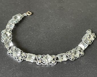 Vintage bracelet, Art Deco paste rhinestone and open backed princess cut crystal geometric silver tone filigree cocktail bracelet