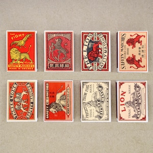 set of 8 MATCHBOX various LION design vintage style printing old matches match holder