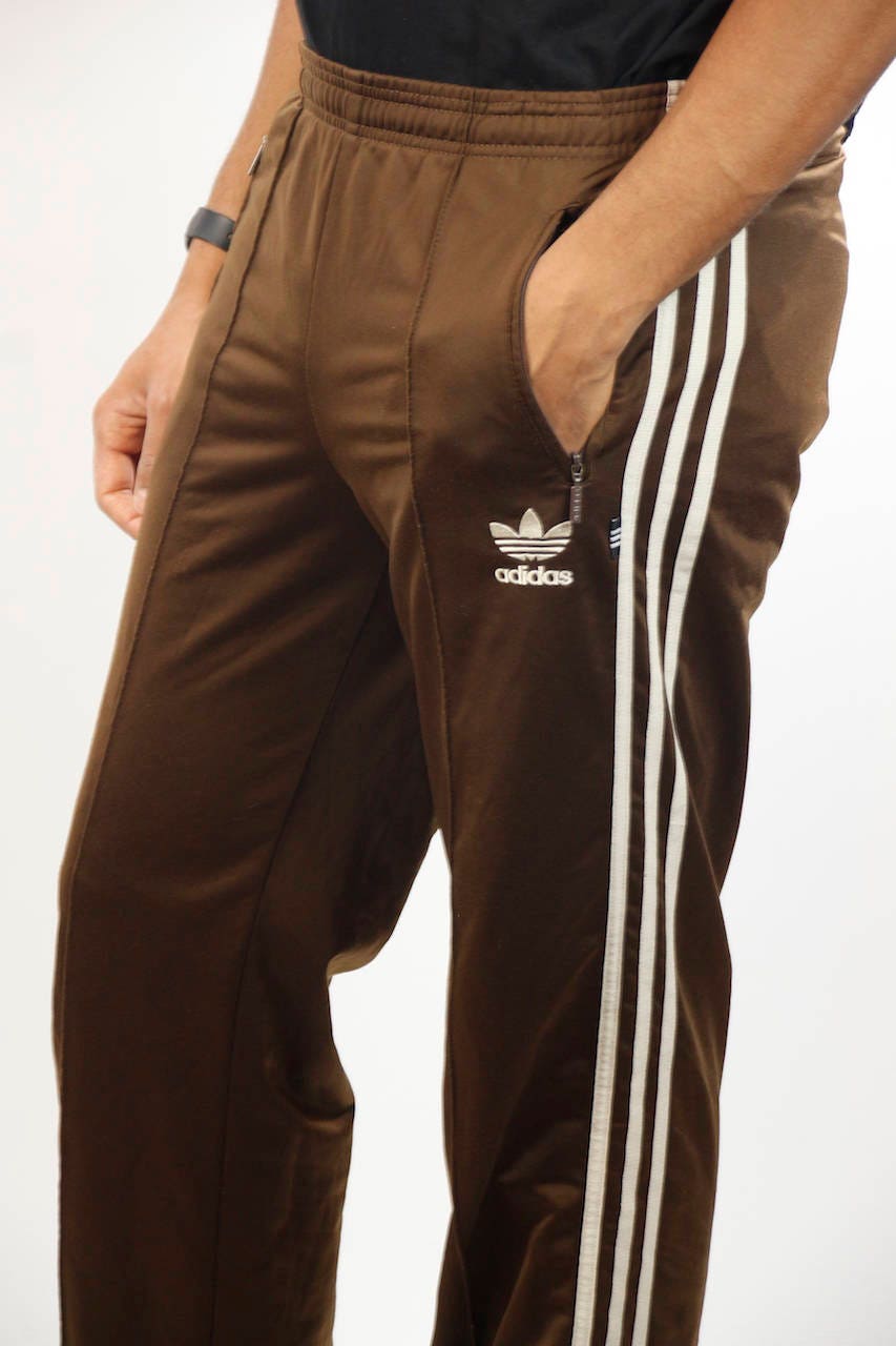brown adidas track pants