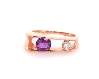 May include: A rose gold ring with a purple amethyst gemstone and a small diamond accent.