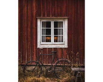 Red Swedish house with vintage bicycle